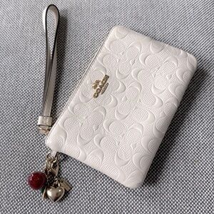 Coach Embossed C Vanilla Wristlet Wallet.